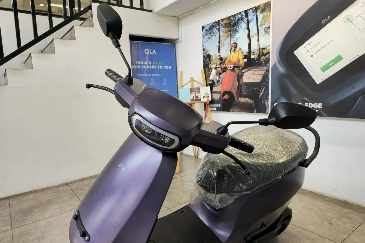 A purple Ola S1 Pro electric scooter parked inside a showroom